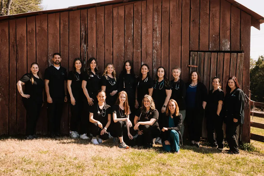 The team at Seymour Veterinary Clinic standing together outside the clinic.
